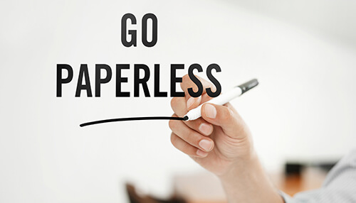 Go paperless - tycoonstory | tycoonstory media Drawing a line with a pen below the words'Go Paperless' to encourage businesses to go paperless for sustainability.