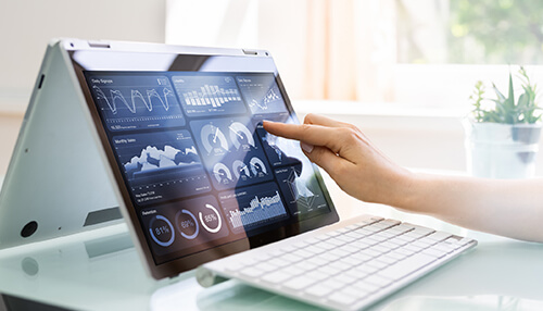 Historical data Business forecasting using historical data displayed on a touchscreen dashboard, with charts and analytics helping analyze past performance to predict future trends.