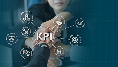 Key performance indicators - tycoonstory | tycoonstory media A group of hands coming together with kpi icons circling them, which signifies teamwork and represents sales training program.