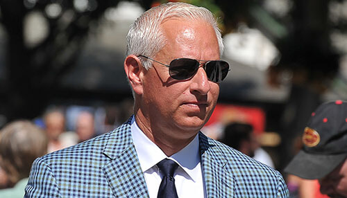 Todd pletcher - tycoonstory | tycoonstory media A person with sunglasses and blue checks blazer, and it represents trainers in horse racing.