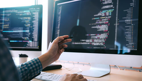 Software freedom Blue vps concept represented on two computer screens displaying coding, symbolizing vps configuration and management through programming.