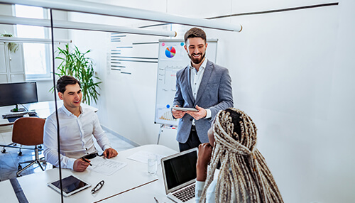 Communicate frequently Customer relationships built through professional communication, shown by a business team meeting and discussing client-focused strategies