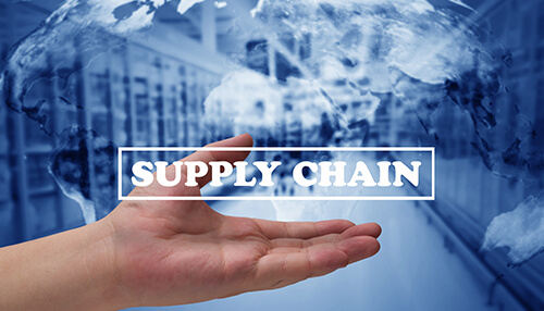 A hand reaching out with the words "supply chain" overlaid, symbolizing the concept of global supply chain management in a business context Innovative solutions to the supply chain in low-cost companies