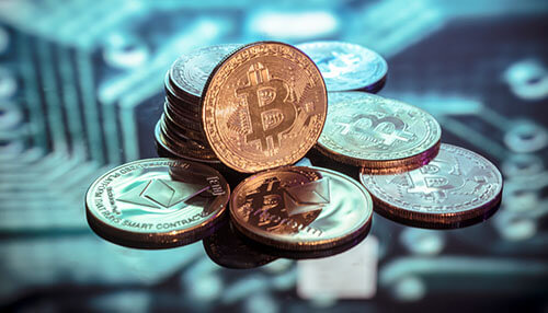 Popular cryptocurrency Bitcoin and ethereum coins stacked together, symbolizing bitcoin trading and cryptocurrency investments in thailand, with digital background representing blockchain.