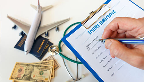 Travel medical insurance covering Travel insurance form being filled with passport, stethoscope, dollars, and flight model beside it for schengen visa application.