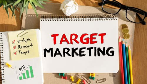 Create a targeted marketing campaign - tycoonstory | tycoonstory media A notebook labeled target marketing sits amid scribbled notes about analyzing data, conducting research and measuring return on investment. These elements showcase ways to increase your business profits by focusing marketing efforts on specific audiences.
