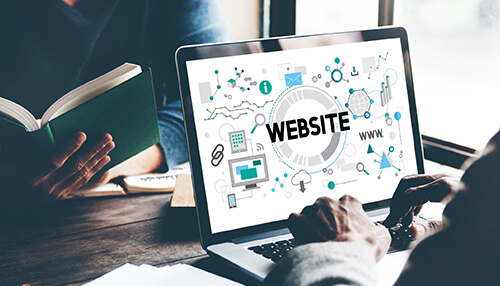 Create an appealing website Close-up of a laptop screen displaying website design, representing the development of an ecommerce business and online presence.