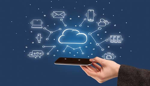 Hosted phone systems - tycoonstory | tycoonstory media Hand holding a smartphone with cloud technology icons connecting various devices and applications, representing cloud-based business phone systems
