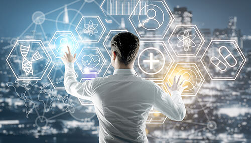 Clinical data management Healthcare analyst interacting with digital medical icons and dashboards, illustrating advanced systems used in clinical data management.