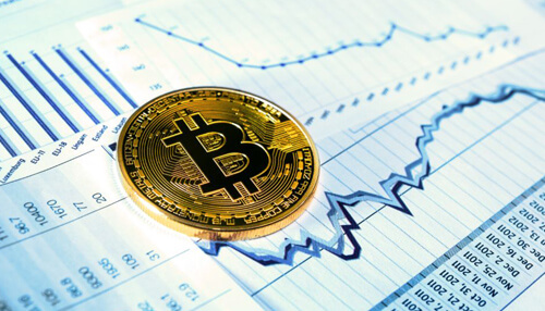 Btc trading opportunity in georgia Physical bitcoin coin placed on stock market charts showing price movement and trends