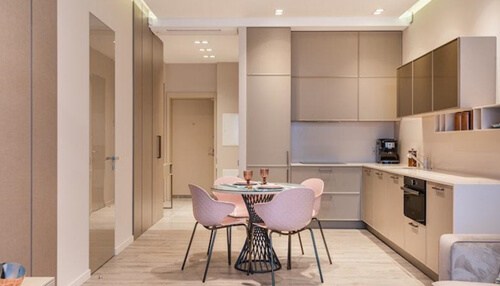 Make sure that the apartment has everything you need A beautifully designed kitchen in a modern apartment, showcasing the living space that comes with renting your first apartment, highlighting style and functionality.