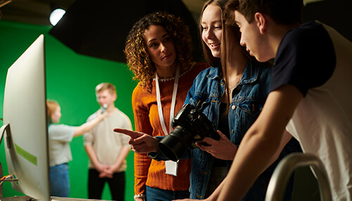 Tourism industry Students collaborating on photography work related to the tourism industry in a studio setting.