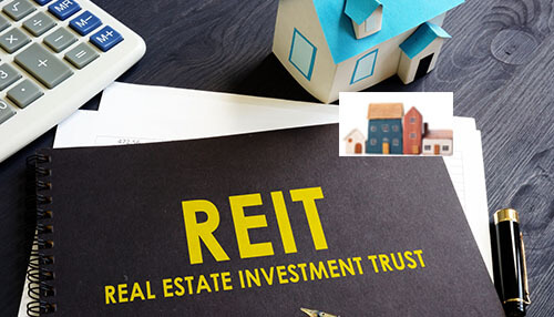 Fundrise Fundrise-related real estate investing concept showing a reit investment notebook, calculator, house model, and financial documents representing alternative real estate investing through fundrise.