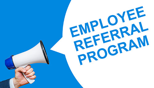 Employee referral program A megaphone announcing'Employee Referral Program,' representing an important strategy within a robust recruitment policy to attract talent.