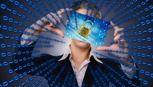 Build your privacy road map Business professional holding a digital image of a padlock, representing the importance of privacy laws in safeguarding personal data