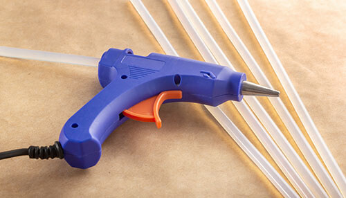 Hot melt glues Hot melt glues gun and glue sticks for crafting and bonding materials.