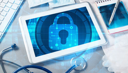 Cybersecurity Medical device manufacturing security concept illustrated by a digital lock on a tablet, highlighting data protection and regulatory compliance.