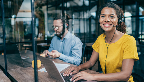 Importance of customer support for businesses Support agents offering multilingual customer support with headsets, reflecting the importance of customer support in figs to enhance customer satisfaction worldwide.