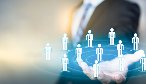 It affects your customers Business professional holding a digital network of human icons, representing team management and organizational structure.