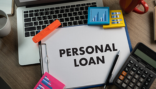 Personal loans for flipping houses Personal loan document surrounded by office tools, representing financial options for flipping houses with no money