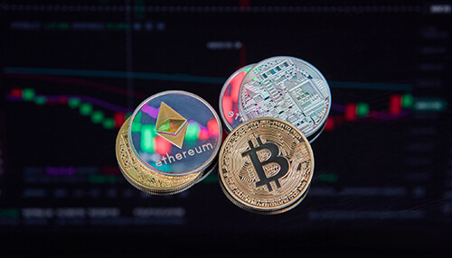 What are the trends in cryptocurrency Floating digital coins such as bitcoin and ethereum in front of a blurred trading chart showing market candlesticks.