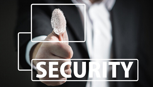 Why do privacy laws matter A person holding a thumbprint with'Security' displayed, symbolizing biometric security measures under privacy laws.