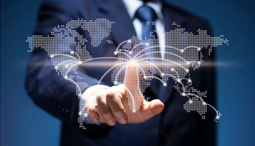 You can reach a wider audience A businessman interacting with a digital world map, representing global reach and expansion through digital marketing.