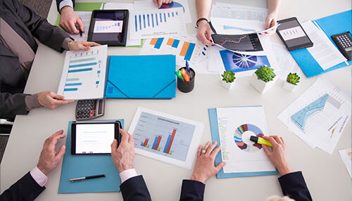 Describe the company's history, business plan, and goals Business onboarding value enhanced by team collaboration, performance charts, and structured onboarding strategy planning in a business meeting