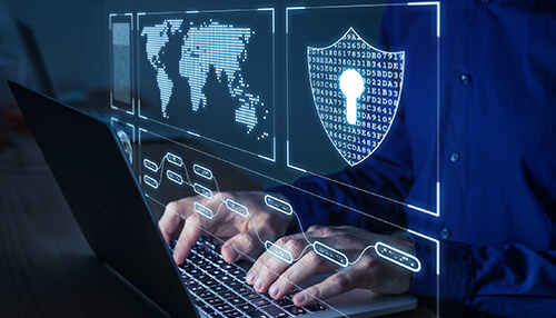 Eu-gdpr - tycoonstory | tycoonstory media Person typing on a laptop with holographic visuals of a shield, world map, and data, pointing out cybersecurity regulations.