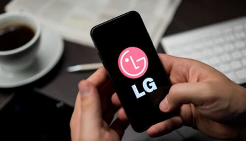Lg smartphone technology - tycoonstory | tycoonstory media Person holding an lg smartphone displaying the lg logo on the screen.