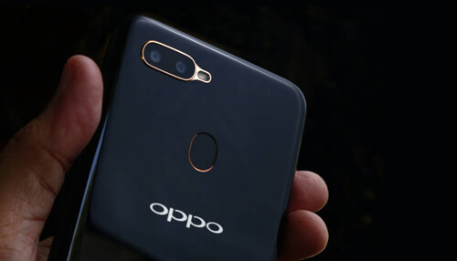 Oppo smartphone technology - tycoonstory | tycoonstory media Close-up shot of oppo smartphone highlighting dual cameras and a fingerprint scanner.