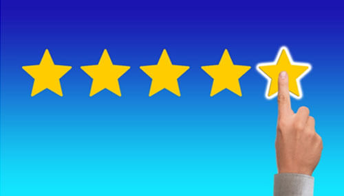 Reviews A hand selecting a 4-star rating out of 5, symbolizing customer feedback and satisfaction for services like moving companies.