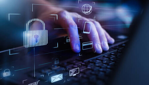 Security - tycoonstory | tycoonstory media Close-up of a hand typing on a laptop, with digital security icons, highlighting the security considerations for bring your own device (byod) practices.