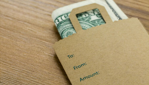 Top tips to better manage business finances Finance envelope with a dollar bill inside, symbolizing money management