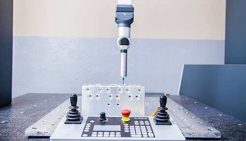 Types of cmms Close-up of two measuring tapes crossed, illustrating the need for accuracy when buying a used cmm and verifying its calibration.