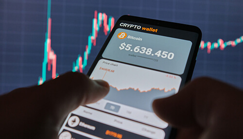What is a crypto wallet Casinos and digital gambling trends shown through a crypto wallet displaying bitcoin value with live market charts on a mobile device.