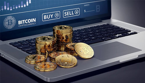 Buy or sell cryptocurrencies Stacks of bitcoin coins on a laptop with a trading interface showing buy and sell options, representing active cryptocurrency trading activities