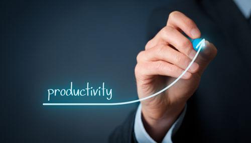 Productivity - tycoonstory | tycoonstory media Hand of a business professional drawing an upward arrow with the word'productivity,' symbolizing growth and efficiency.