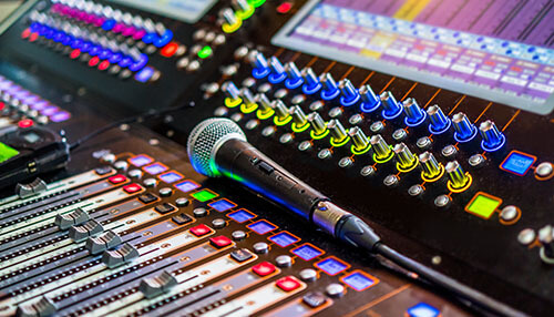 Sound effects Sensory stimulation professional audio mixing console with colorful led controls and microphone, highlighting sound engineering and immersive acoustic experience.