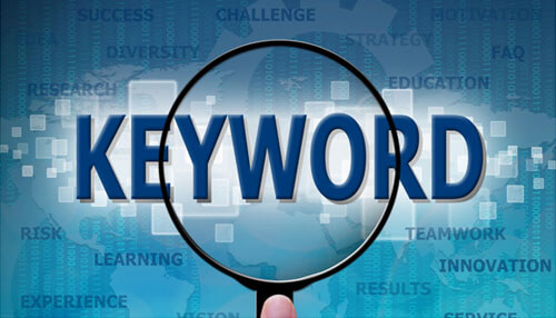 Choose right keywords and don’t overstuff Magnifying glass highlighting the word “keyword” symbolizing keyword research for digital marketing.