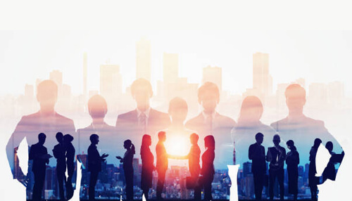 Communication challenges Silhouettes of business professionals shaking hands against a city skyline, illustrating collaboration and the power of strategic alliances in business growth.