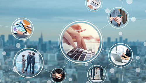 Network Digital networking concept illustrating small business connections, with a central laptop keyboard surrounded by linked icons of professionals, mobile devices, teamwork, and online collaboration against a city skyline background.