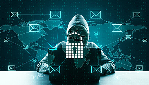 Spear phishing Hacker using a laptop with locked data and email icons on a global network, representing cybercrime and phishing attacks on users worldwide.