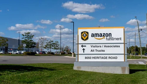 Use fulfillment by amazon Amazon seller logistics represented by an amazon fulfillment center sign highlighting shipping and order processing operations