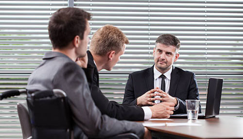 Bank reconciliation is worthless if there is no separation of duties Bank reconciliation discussion in a professional office setting, showing finance team members meeting to review controls and emphasize separation of duties for accurate bank reconciliation.