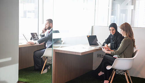 Workplace flexibility Employees collaborating in a flexible office environment reflecting era brands’ modern workplace approach.
