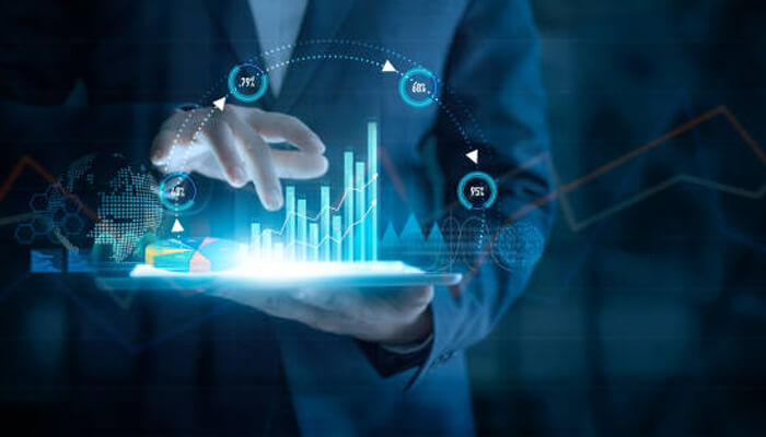 Competitor analysis - tycoonstory | tycoonstory media A business professional analyzing growth statistics on a digital tablet, visualizing foreign direct investment data and trends.