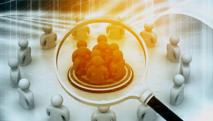 Connect with local niche bloggers Magnifying glass highlighting a group of targeted audience figures, symbolizing audience analysis and advanced seo tactics for better reach