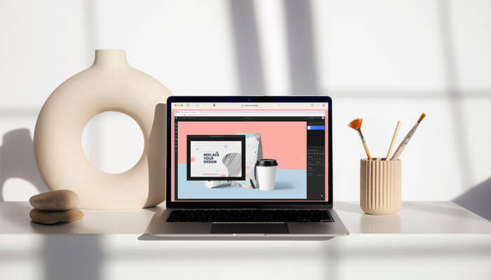 Creating a mockup A non-technical entrepreneur working on creative business designs using a laptop, symbolizing the importance of design and creativity in startups.