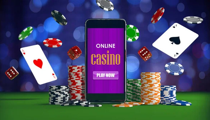 Features Online Casinos Need in Light of Germany’s New Gambling Law A smartphone showing an “Online Casino” interface surrounded by playing cards, dice, and colorful poker chips, illustrating the excitement and gaming options offered by Online Casinos.